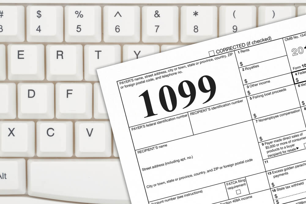 A Us Federal Tax 1099 Income Tax Form on a Keyboard